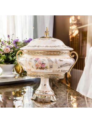 Scatola, cofanetto portagioie elegante in ceramica pregiata, con leganti dettagli floreai e dorati.